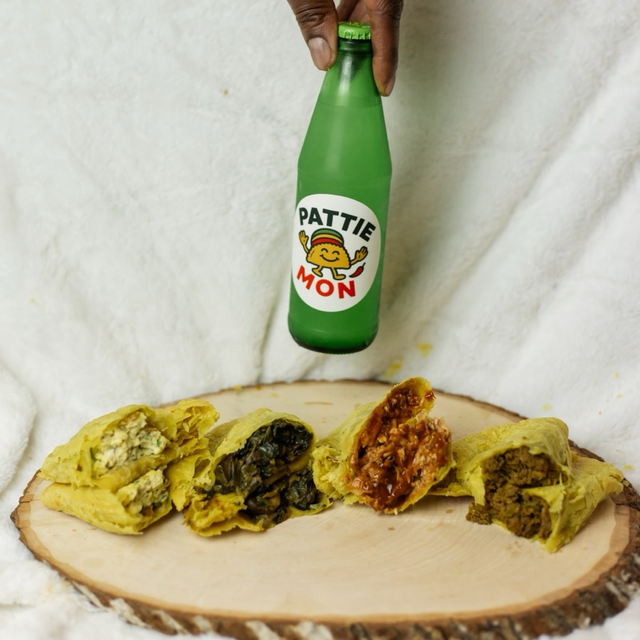 All four Pattie Mon flavours cut open in a row beside a green Pattie Mon bottle